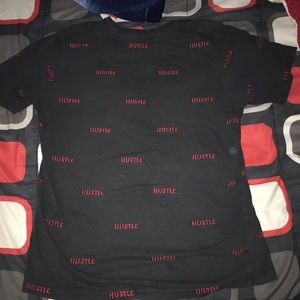 selling a medium sized shirt with the word hustle
